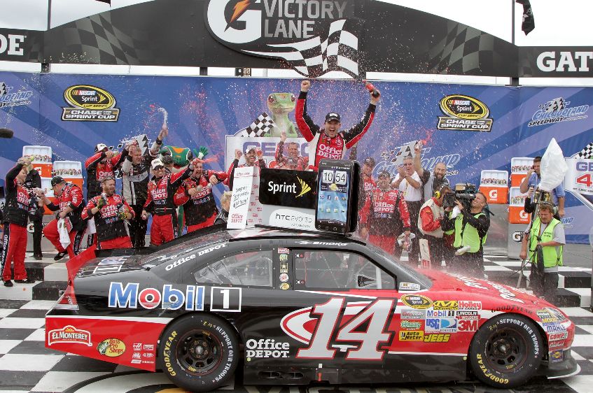 Credit: Jerry Markland/Getty Images for NASCAR Tony Stewart celebrating with his team in Victory Lane after winning the NASCAR Sprint Cup Series GEICO 400 at Chicagoland Speedway on Sept. 19 in Joliet, Ill.